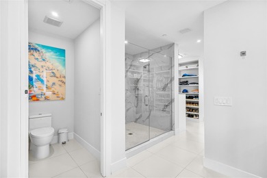 Experience elevated waterfront living in this rarely available