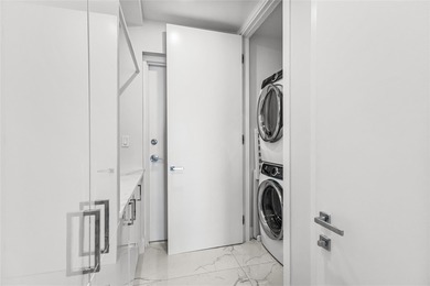 Experience elevated waterfront living in this rarely available