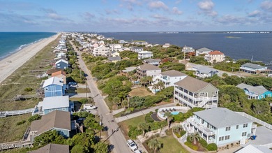 Perched on an elevated lot, this beautiful second-row home