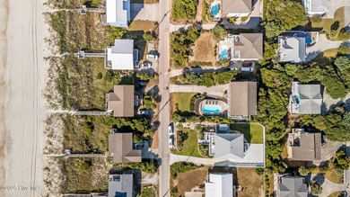 Perched on an elevated lot, this beautiful second-row home