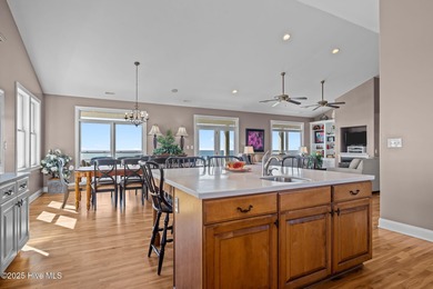 Perched on an elevated lot, this beautiful second-row home