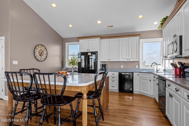 Perched on an elevated lot, this beautiful second-row home