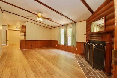 Tucked away on a quiet street sits this cozy half acre lot with