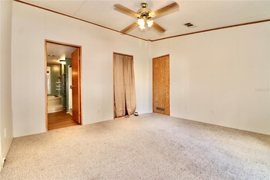 Tucked away on a quiet street sits this cozy half acre lot with