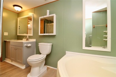 Tucked away on a quiet street sits this cozy half acre lot with