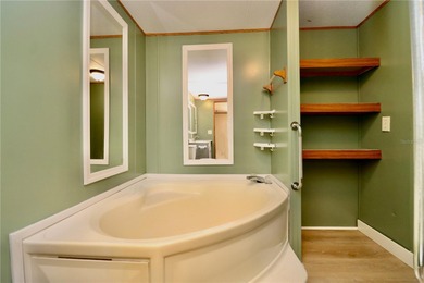 Tucked away on a quiet street sits this cozy half acre lot with