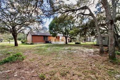 Tucked away on a quiet street sits this cozy half acre lot with