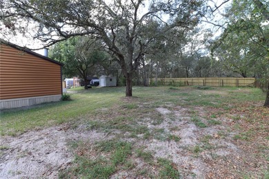 Tucked away on a quiet street sits this cozy half acre lot with