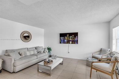 Live the true South Florida lifestyle in this beautifully