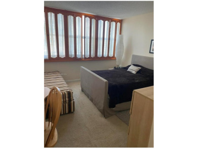 This spacious 2-bedroom, 2-bathroom condo at 1410 S Ocean Drive