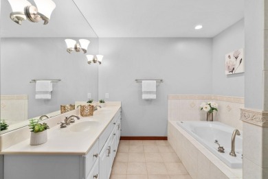 Experience refined waterfront living in this expansive