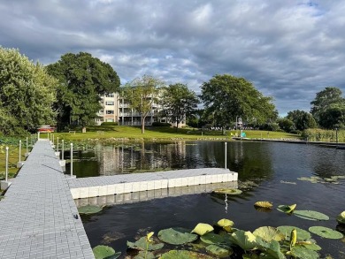 Experience refined waterfront living in this expansive