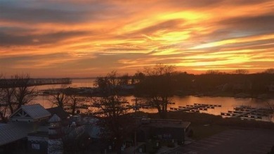 Experience refined waterfront living in this expansive