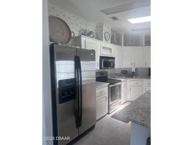 This immaculate home in a 55-plus community is move-in ready and