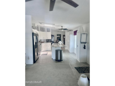 This immaculate home in a 55-plus community is move-in ready and