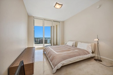 Contemporary elegance abounds in this luxury residence in gated