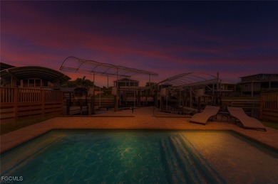 This beautifully remodeled 2-bedroom, 2.5-bath waterfront POOL