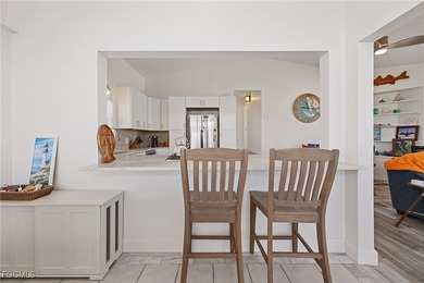 This beautifully remodeled 2-bedroom, 2.5-bath waterfront POOL