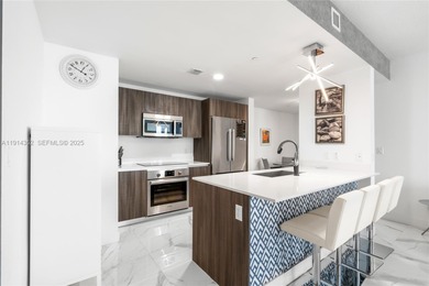 Welcome to Unit 4309 at Aria on the Bay -- a bright and spacious