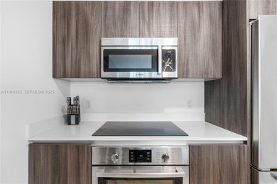 Welcome to Unit 4309 at Aria on the Bay -- a bright and spacious