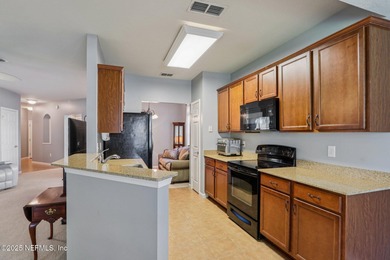 Welcome to this charming ground-level, end unit condo in the