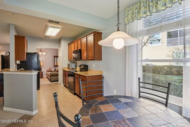 Welcome to this charming ground-level, end unit condo in the