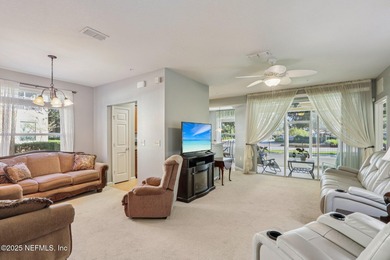 Welcome to this charming ground-level, end unit condo in the