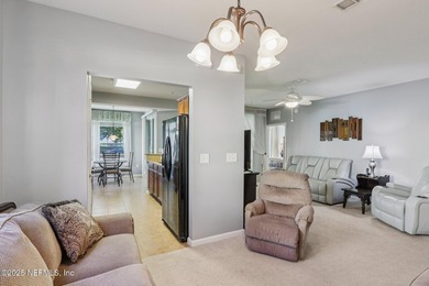 Welcome to this charming ground-level, end unit condo in the