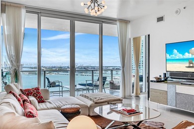 Experience refined waterfront living in this expansive unit
