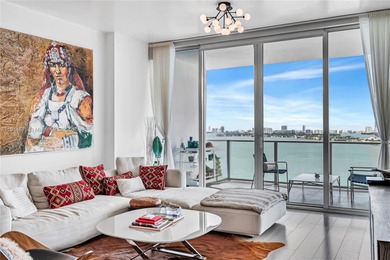 Experience refined waterfront living in this expansive unit