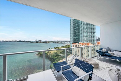 Experience refined waterfront living in this expansive unit