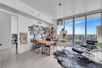 Experience refined waterfront living in this expansive unit