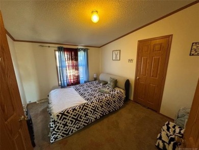 Welcome to 34 Bokchito in Canadian! This 4-bedroom, 2 bath home