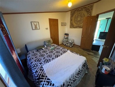 Welcome to 34 Bokchito in Canadian! This 4-bedroom, 2 bath home