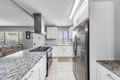 Experience unparalleled lakeside living in this BEAUTIFULLY