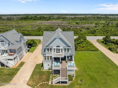 This exquisite, fully furnished oceanfront home in the coveted