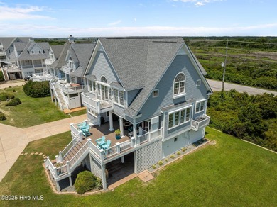 This exquisite, fully furnished oceanfront home in the coveted