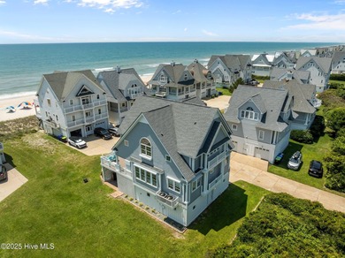 This exquisite, fully furnished oceanfront home in the coveted