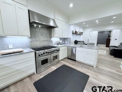 Updated kitchen and bathrooms!  Welcome to refined luxury living