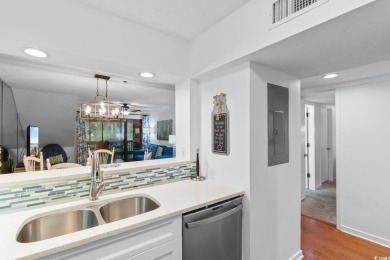 This move-in ready, updated two-bedroom, two-bath condo features