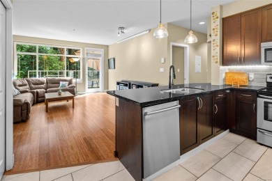 Serene ground level corner unit steps to the Royal Colwood Golf