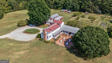 Nestled along the shores of Lake Oconee, this extraordinary