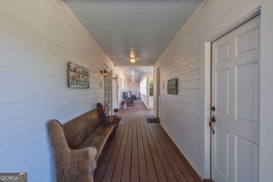 Nestled along the shores of Lake Oconee, this extraordinary