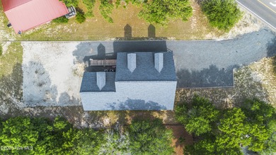 This spacious coastal home sits in the middle of a generous