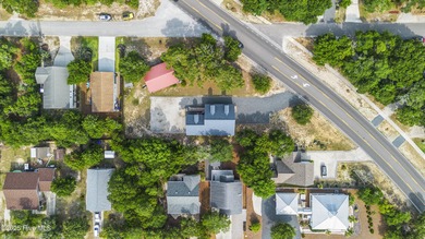 This spacious coastal home sits in the middle of a generous