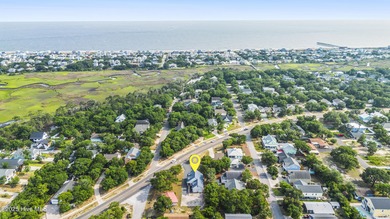 This spacious coastal home sits in the middle of a generous