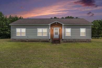 No HOA! This 3-bedroom, 2-bath home sits on over an acre of land