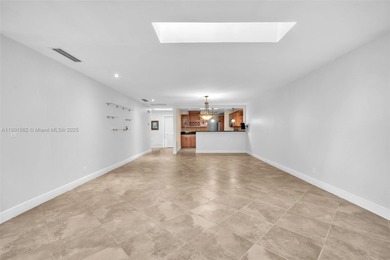 Corner one-level townhome in the sought-after Emerald Hills