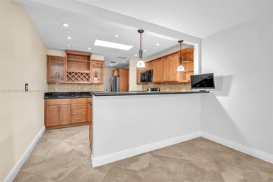 Corner one-level townhome in the sought-after Emerald Hills