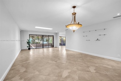 Corner one-level townhome in the sought-after Emerald Hills